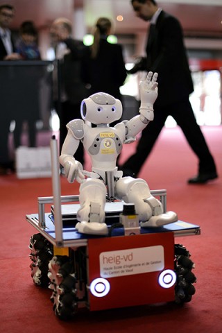 A robot seated on a small vehicle