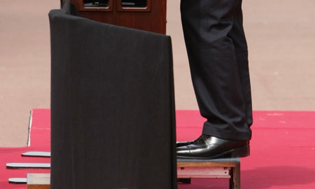 Nicolas-Sarkozy-stands-on-001